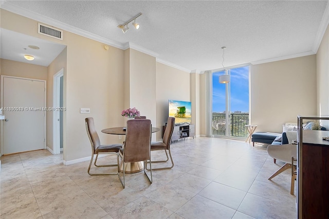 520 SE 5th Ave Unit 1707, Fort Lauderdale, FL 33301 - dining room featuring a textured ceiling, ornamental molding, expansive windows, and light tile patterned floors