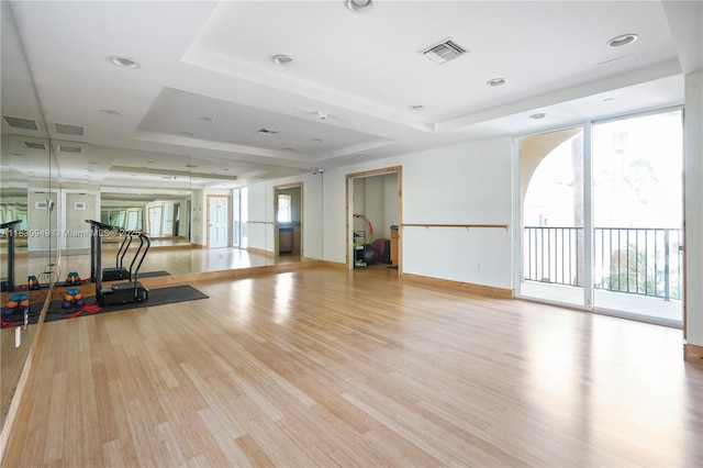 520 SE 5th Ave Unit 1707, Fort Lauderdale, FL 33301 - workout area with a raised ceiling, wood finished floors, and a wall of windows
