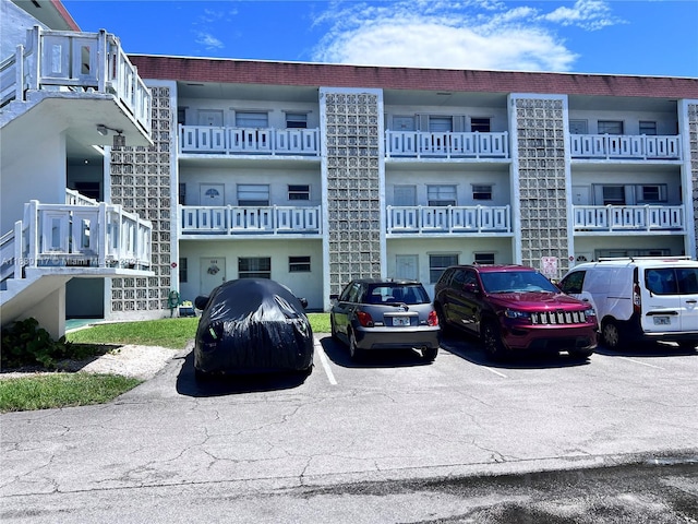 1280 NW 43rd Ter Unit 203, Lauderhill, FL 33313 - view of apartment building / complex featuring uncovered parking