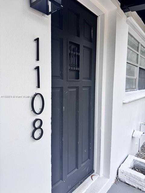 1108 SW 22nd Ave, Fort Lauderdale, FL 33312 - doorway to property with stucco siding