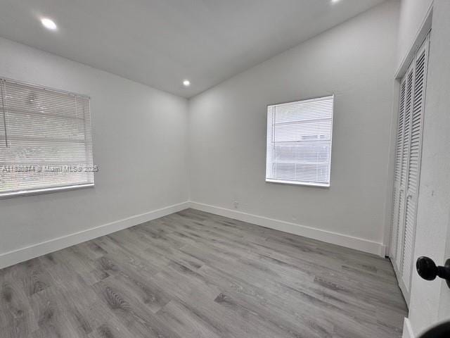1108 SW 22nd Ave, Fort Lauderdale, FL 33312 - unfurnished bedroom featuring a closet, wood finished floors, and recessed lighting