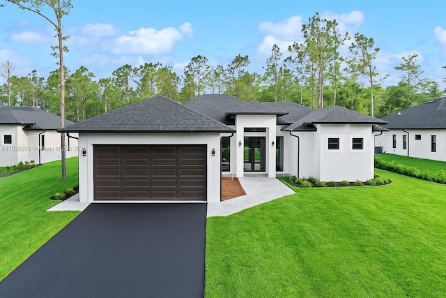 3324 NE 27, Naples, FL 34120 - view of front facade featuring asphalt driveway, a garage, a front yard, and stucco siding