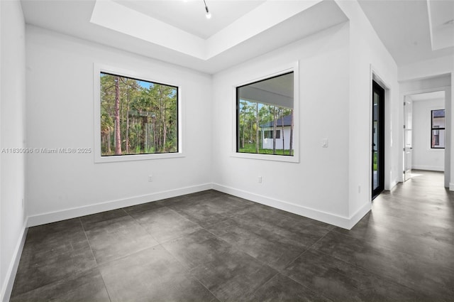 3324 NE 27, Naples, FL 34120 - spare room featuring healthy amount of natural light and finished concrete floors