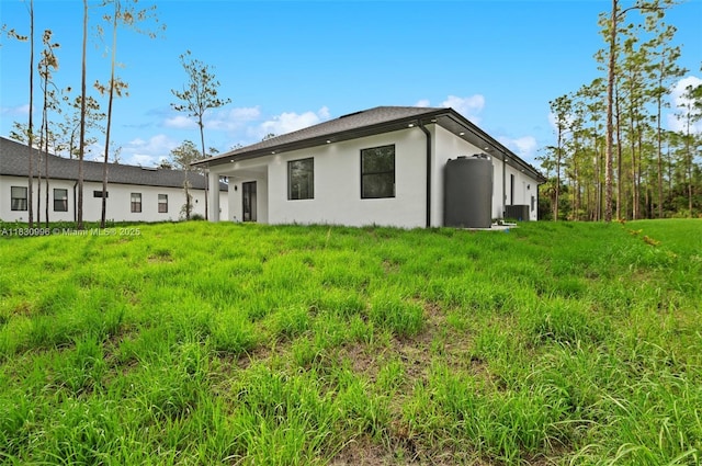 3324 NE 27, Naples, FL 34120 - rear view of property with stucco siding