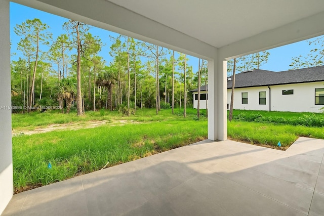 3324 NE 27, Naples, FL 34120 - view of yard featuring a patio