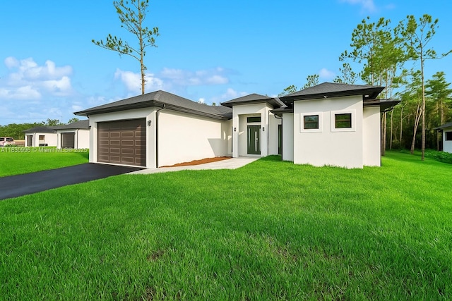 3324 NE 27, Naples, FL 34120 - prairie-style home with stucco siding, a garage, a front lawn, and asphalt driveway