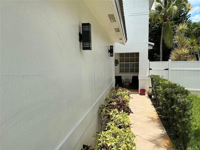651 SW 176th Ave, Pembroke Pines, FL 33029 - view of side of property with stucco siding and a patio area
