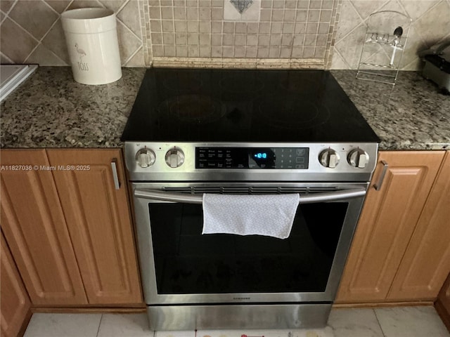 651 SW 176th Ave, Pembroke Pines, FL 33029 - kitchen featuring stainless steel range with electric stovetop, decorative backsplash, stone countertops, and light tile patterned floors