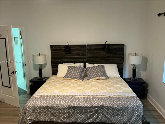 651 SW 176th Ave, Pembroke Pines, FL 33029 - bedroom featuring wood finished floors and baseboards