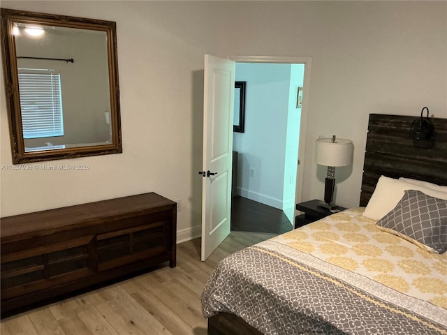 651 SW 176th Ave, Pembroke Pines, FL 33029 - bedroom featuring wood finished floors and baseboards
