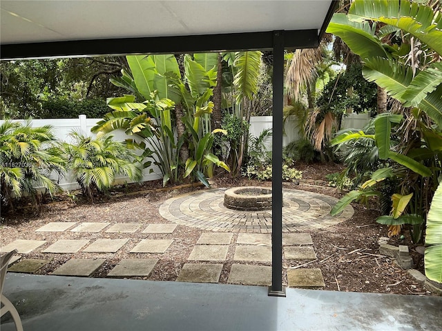 651 SW 176th Ave, Pembroke Pines, FL 33029 - fenced backyard with an outdoor fire pit and a patio area