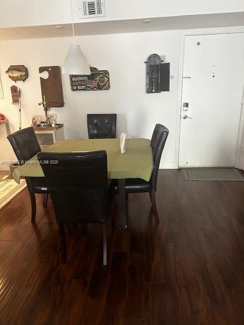 1428 SE 4th Ave Unit 254, Deerfield Beach, FL 33441 - dining space featuring dark wood-type flooring