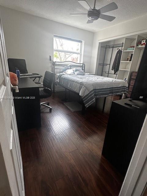 1428 SE 4th Ave Unit 254, Deerfield Beach, FL 33441 - bedroom with a textured ceiling, wood finished floors, an office area, and ceiling fan