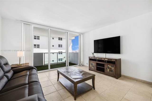 1200 W Ave Unit 1419, Miami Beach, FL 33139 - living room with light tile patterned flooring and floor to ceiling windows