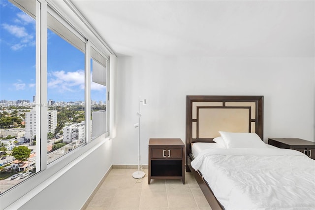 1200 W Ave Unit 1419, Miami Beach, FL 33139 - bedroom featuring a city view and light tile patterned floors
