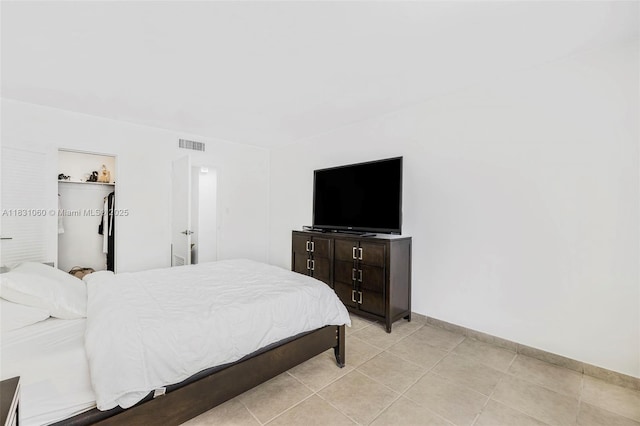 1200 W Ave Unit 1419, Miami Beach, FL 33139 - bedroom with light tile patterned flooring and a spacious closet
