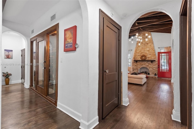 1320 Obispo Ave, Coral Gables, FL 33134 - hall featuring dark wood-style flooring and arched walkways
