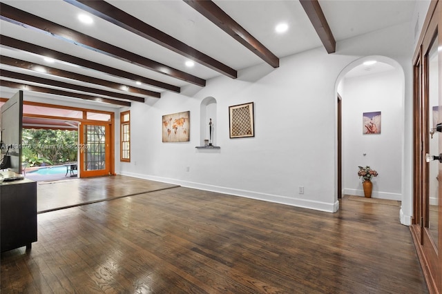 1320 Obispo Ave, Coral Gables, FL 33134 - unfurnished living room with arched walkways, wood finished floors, beam ceiling, french doors, and recessed lighting