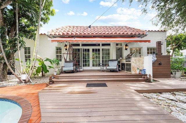 1320 Obispo Ave, Coral Gables, FL 33134 - rear view of property featuring french doors, a tiled roof, a deck, and stucco siding