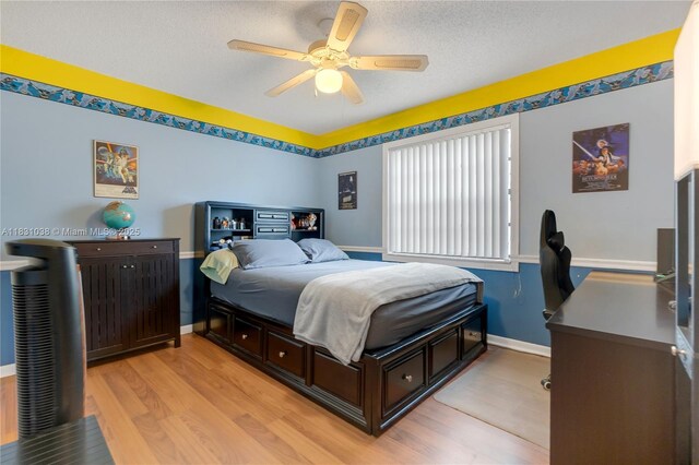 6740 NW 45th St, Lauderhill, FL 33319 - bedroom featuring light wood-style flooring, a textured ceiling, and ceiling fan