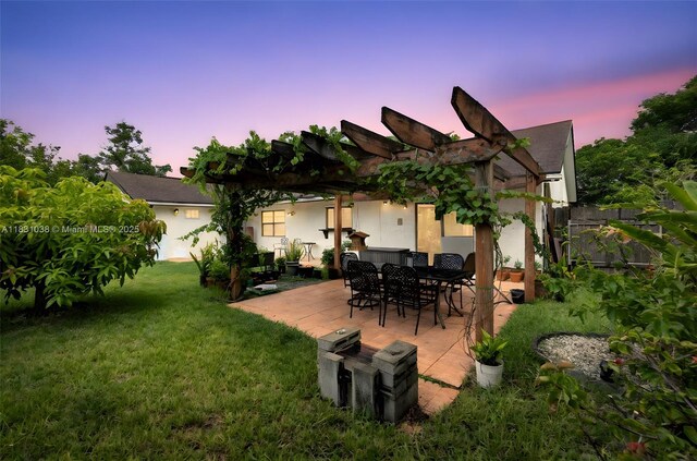 6740 NW 45th St, Lauderhill, FL 33319 - yard at dusk with a patio and a lawn