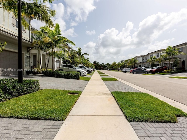 4923 NW 48th Ter, Tamarac, FL 33319 - view of asphalt road with sidewalks and a residential view