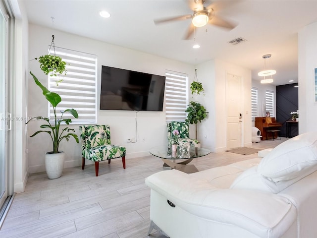 4923 NW 48th Ter, Tamarac, FL 33319 - living room featuring a ceiling fan, recessed lighting, and light wood finished floors