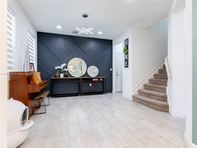4923 NW 48th Ter, Tamarac, FL 33319 - entryway with stairway, a decorative wall, wood finished floors, a chandelier, and recessed lighting