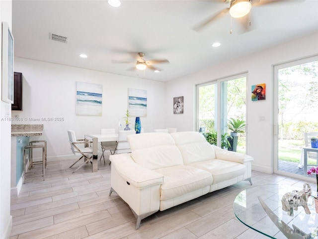 4923 NW 48th Ter, Tamarac, FL 33319 - living area with a ceiling fan, light wood-style floors, and recessed lighting