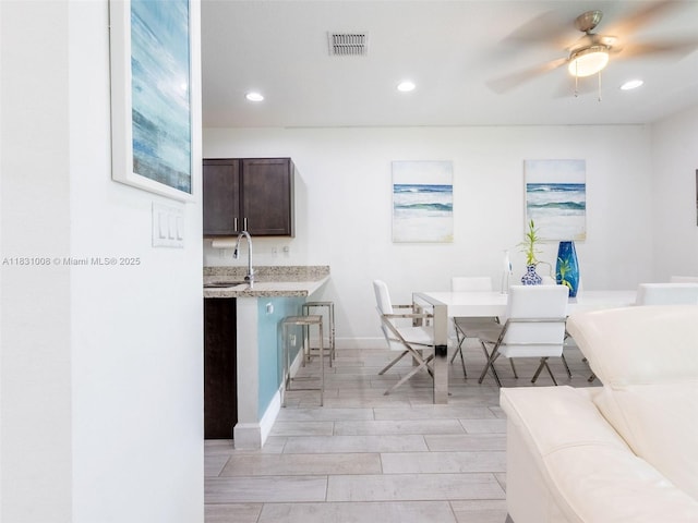 4923 NW 48th Ter, Tamarac, FL 33319 - dining area featuring recessed lighting, ceiling fan, and wood tiled floors