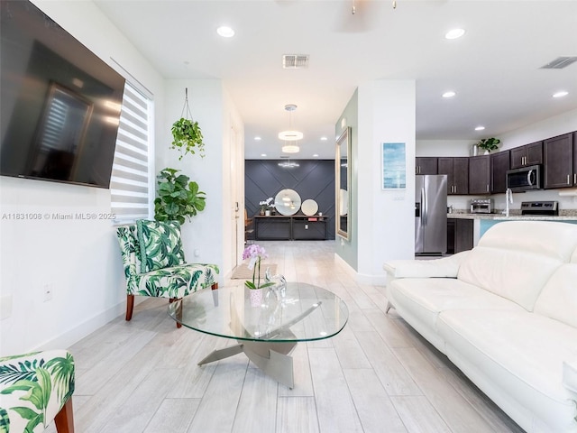 4923 NW 48th Ter, Tamarac, FL 33319 - living area featuring recessed lighting and light wood finished floors