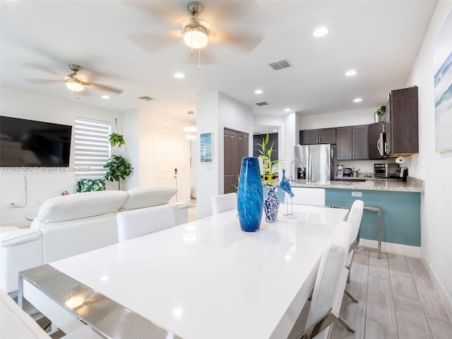 4923 NW 48th Ter, Tamarac, FL 33319 - dining area featuring a ceiling fan and recessed lighting
