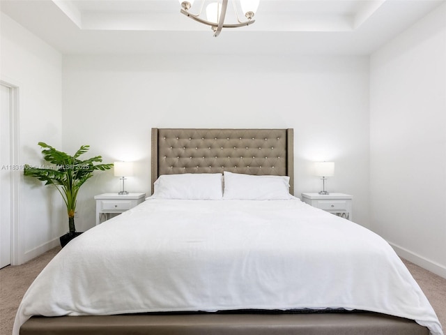 4923 NW 48th Ter, Tamarac, FL 33319 - bedroom featuring carpet, a tray ceiling, and a chandelier