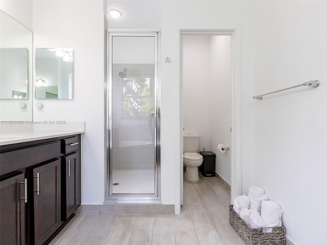 4923 NW 48th Ter, Tamarac, FL 33319 - full bathroom with vanity, a shower stall, and wood finished floors