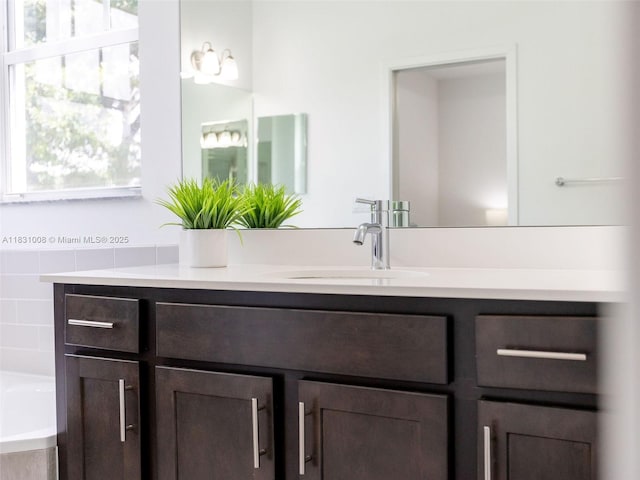 4923 NW 48th Ter, Tamarac, FL 33319 - bathroom with vanity and tiled tub