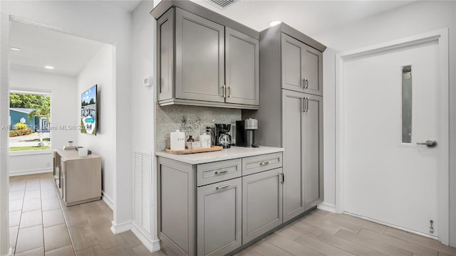 10401 NW 21st St, Pembroke Pines, FL 33026 - bar area with backsplash, light wood finished floors, and recessed lighting