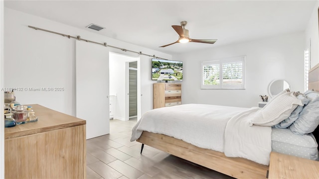 10401 NW 21st St, Pembroke Pines, FL 33026 - bedroom with a barn door and a ceiling fan