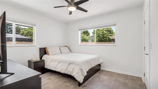 10401 NW 21st St, Pembroke Pines, FL 33026 - bedroom featuring multiple windows, wood finished floors, and ceiling fan