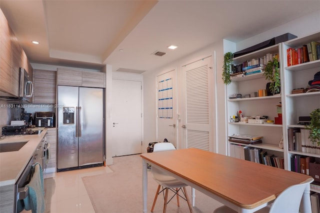 121 NE 34th St Unit 3110, Miami, FL 33137 - kitchen with stainless steel appliances, light countertops, modern cabinets, open shelves, and recessed lighting
