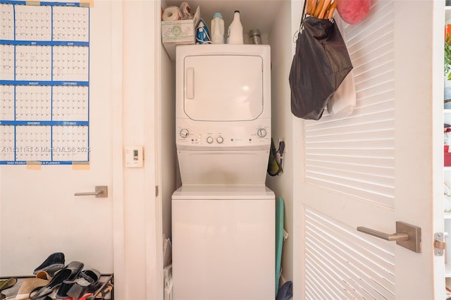 121 NE 34th St Unit 3110, Miami, FL 33137 - washroom featuring stacked washer / drying machine