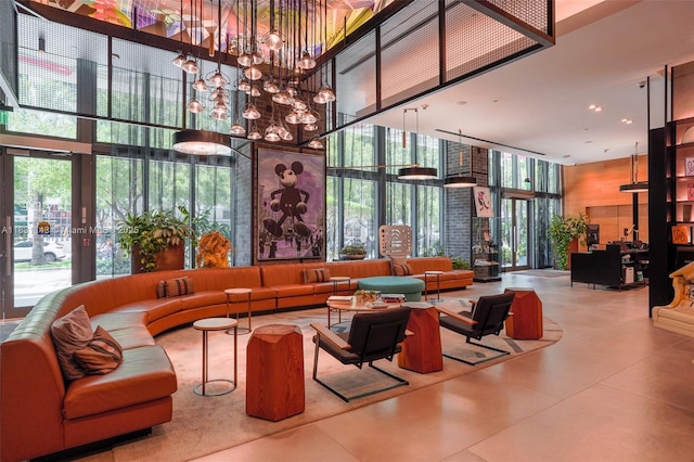 121 NE 34th St Unit 3110, Miami, FL 33137 - common area with a towering ceiling and a wall of windows