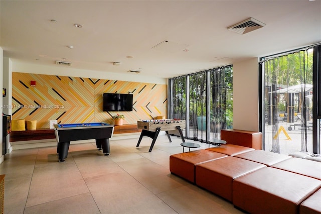 121 NE 34th St Unit 3110, Miami, FL 33137 - recreation room with expansive windows, billiards, and an accent wall