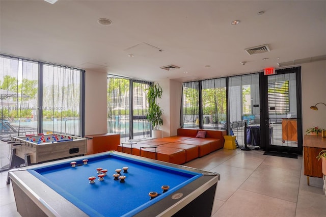 121 NE 34th St Unit 3110, Miami, FL 33137 - recreation room with expansive windows and tile patterned floors