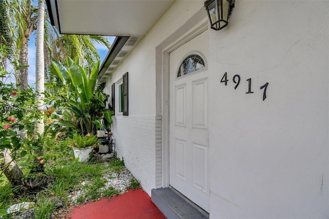 4917 SW 43rd Ter, Dania Beach, FL 33314 - view of exterior entry featuring stucco siding