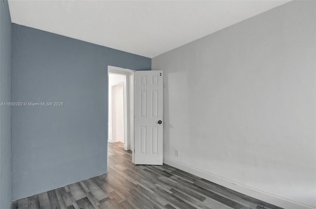 4917 SW 43rd Ter, Dania Beach, FL 33314 - spare room featuring wood finished floors and baseboards