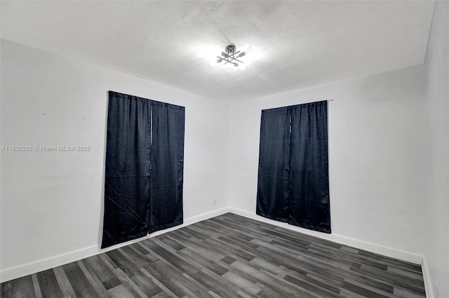 4917 SW 43rd Ter, Dania Beach, FL 33314 - spare room with dark wood-style flooring and baseboards