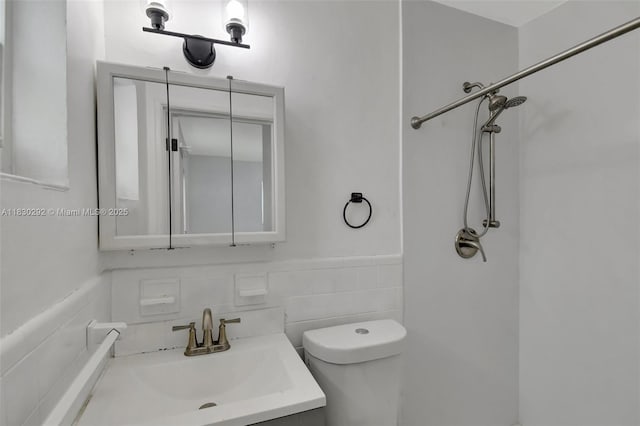 4917 SW 43rd Ter, Dania Beach, FL 33314 - full bath featuring a shower, vanity, tile walls, and a wainscoted wall