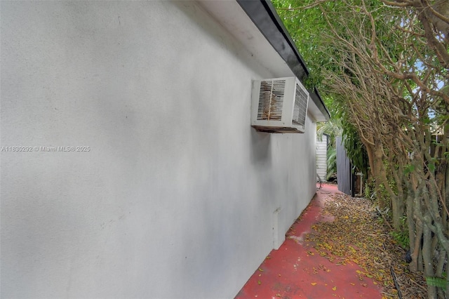 4917 SW 43rd Ter, Dania Beach, FL 33314 - view of property exterior featuring stucco siding and a wall mounted AC