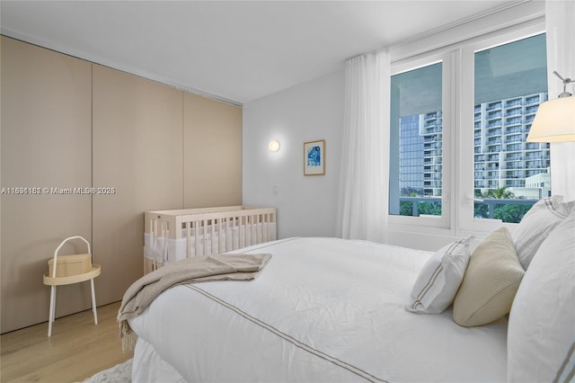 2301 Collins Ave Unit 407, Miami Beach, FL 33139 - bedroom featuring wood finished floors