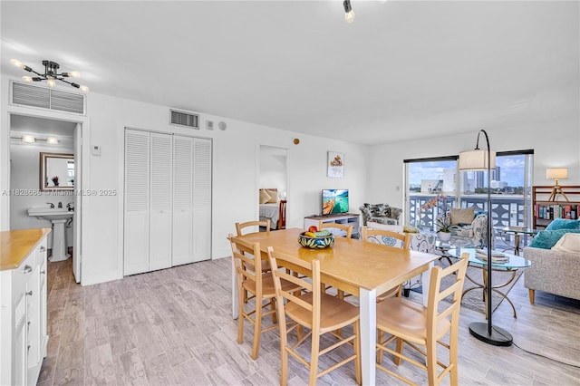 4141 Nautilus Dr Unit 7J, Miami Beach, FL 33140 - dining room with light wood-type flooring